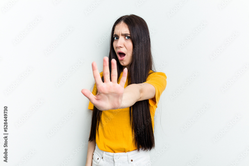 Young caucasian woman isolated on white background being shocked due to an imminent danger Young caucasian woman isolated on white background being shocked due to an imminent danger