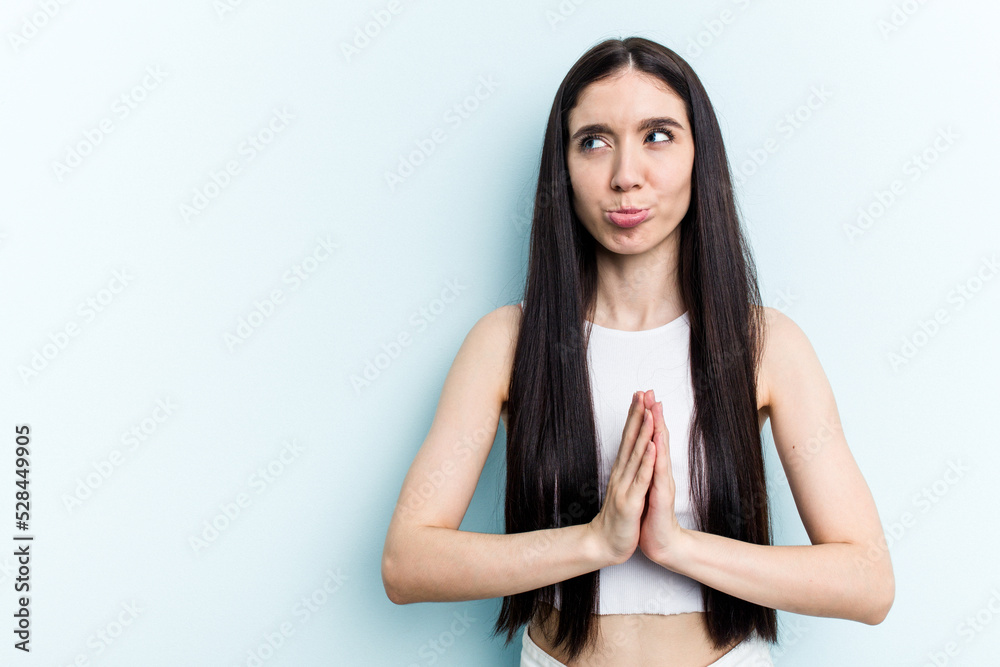 Young caucasian woman isolated on blue background making up plan in mind, setting up an idea. Young caucasian woman isolated on blue background making up plan in mind, setting up an idea.