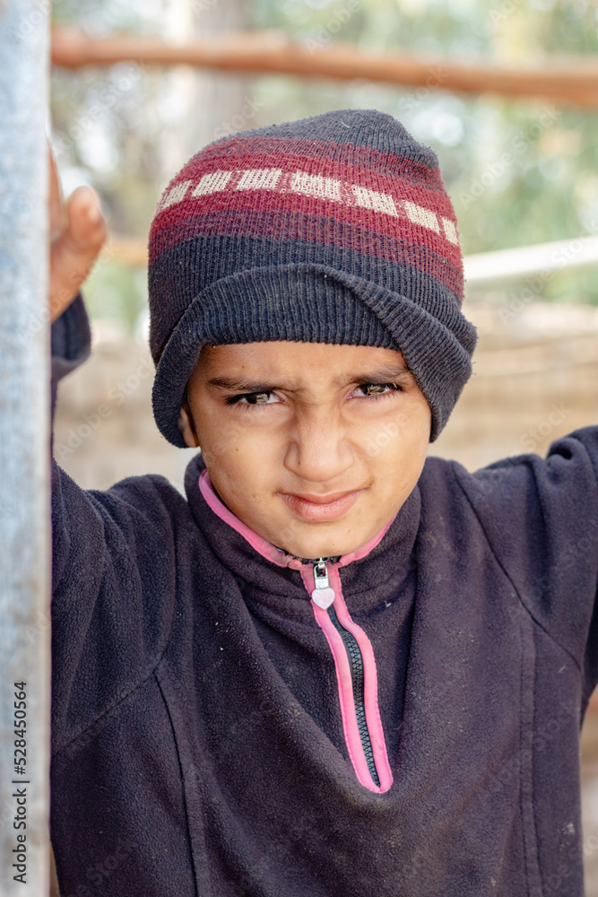 a child with a sad expression cause of flood and homelessness situation a child with a sad expression cause of flood and homelessness situation