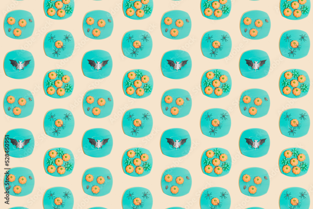 Retro Halloween pattern. Turquoise color plates with pumpkins, spiders, bat, ribbons and flies. Vintage aesthetic background. Retro Halloween pattern. Turquoise color plates with pumpkins, spiders, bat, ribbons and flies. Vintage aesthetic background.