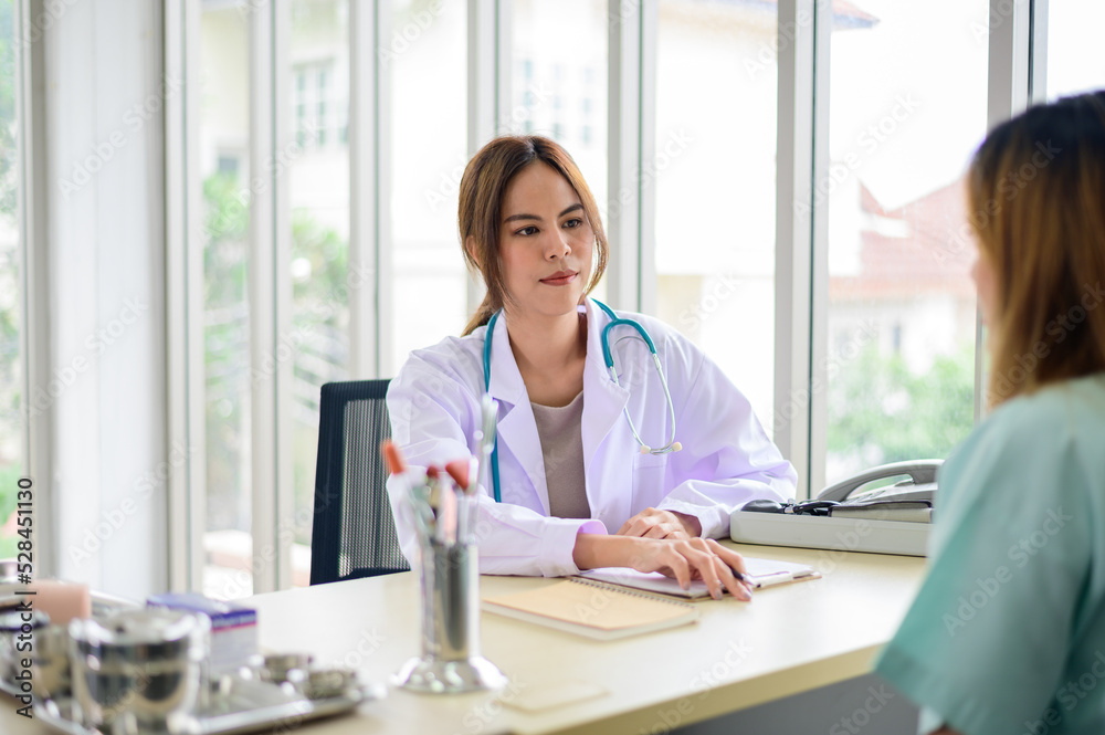 Doctor questioning patient in office and writing answers in clipboard Doctor questioning patient in office and writing answers in clipboard