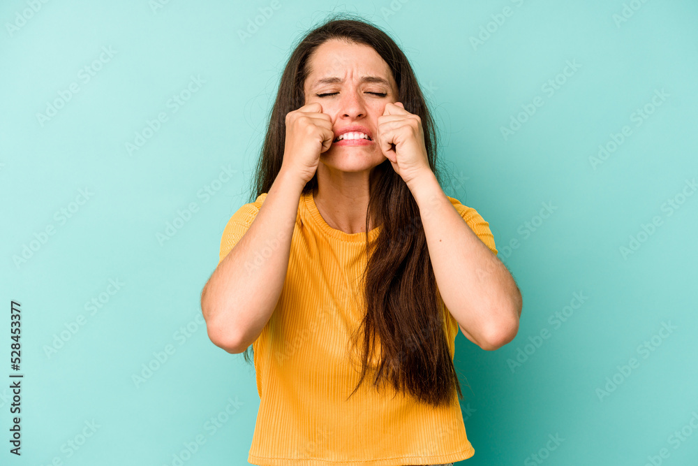 Young caucasian woman isolated on blue background whining and crying disconsolately. Young caucasian woman isolated on blue background whining and crying disconsolately.