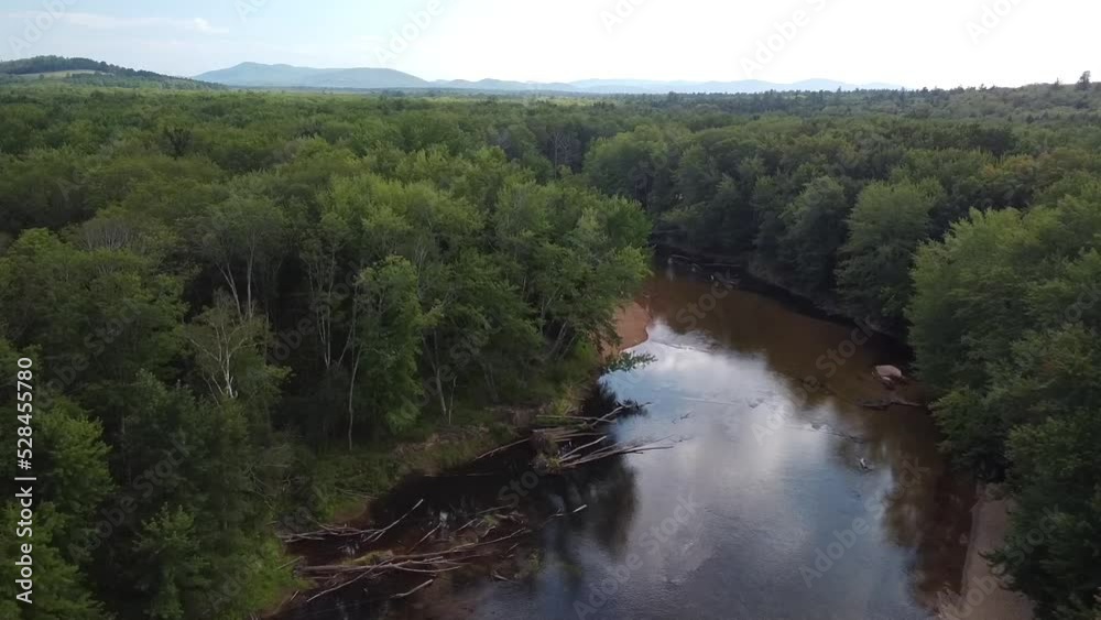 Drone shot of a mountains, trees and sky reflecting in a bend in the Saco River in Fryeburg, Maine. Drone shot of a mountains, trees and sky reflecting in a bend in the Saco River in Fryeburg, Maine.