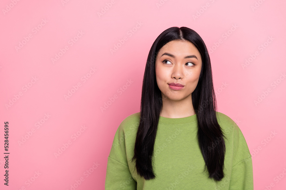 Photo of nice brunette young lady look promo wear green sweater isolated on pink color background Photo of nice brunette young lady look promo wear green sweater isolated on pink color background