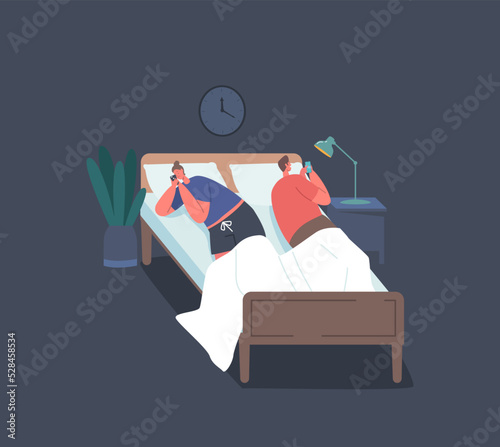 Internet Addiction, Family Problems. Young Couple Man and Woman Lying in Bed Back to Back with Smartphones in Hands