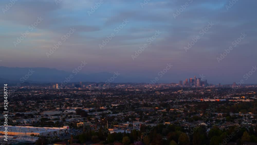 Aerial Lockdown Time Lapse Shot Of Financial District In City Under Cloudy Sky From Dusk To Night - Los Angeles, California Aerial Lockdown Time Lapse Shot Of Financial District In City Under Cloudy Sky From Dusk To Night - Los Angeles, California