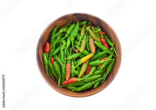 Paprika (Thai) in a wooden bowl isolated on white background. Top view.