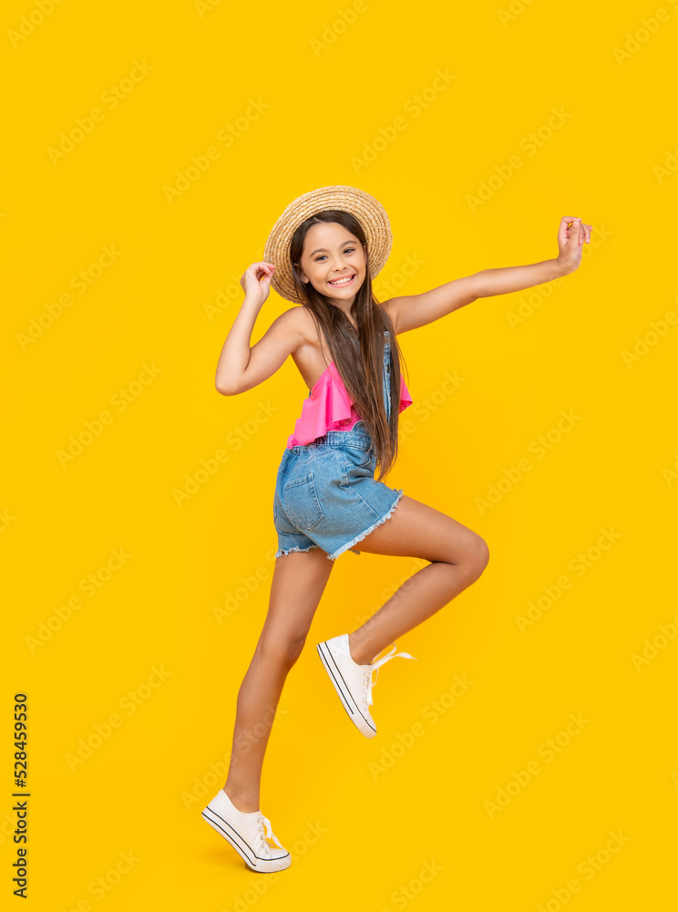 cute teen girl in straw hat running on yellow background cute teen girl in straw hat running on yellow background