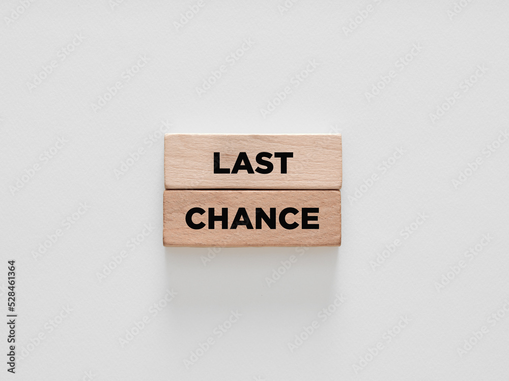 The words last chance on wooden blocks on white background. The words last chance on wooden blocks on white background.