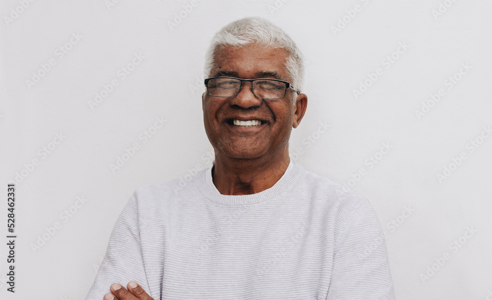 Happy senior man smiling at the camera Happy senior man smiling at the camera