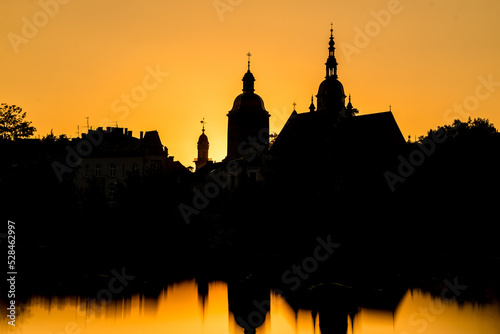 Silhouettes of buildings in town center during sunset. Architercture of Nowy Sacz, town in Poland photo