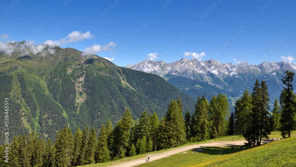 Summer mountain landscape and blue sky with clouds. Location place Alps, Europe.