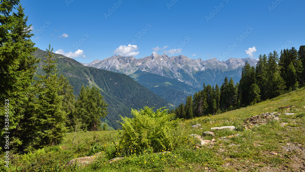 Summer landscape in mountains and blue sky with clouds. Location place Alps, Tyrol, Austria, Europe. Summer landscape in mountains and blue sky with clouds. Location place Alps, Tyrol, Austria, Europe.