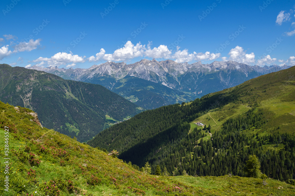 Fototapeta premium Summer mountain landscape and blue sky with clouds. Location place Alps, Europe.