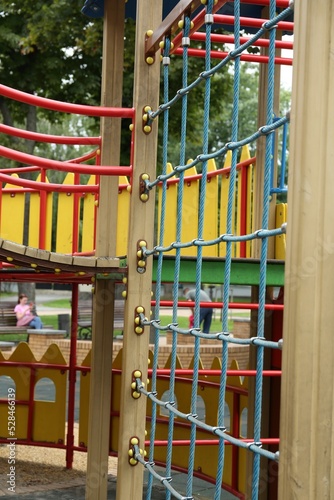 Children s playground with climbing rope net on summer day