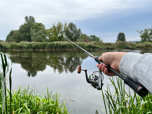 Man fishing on the river in the morning