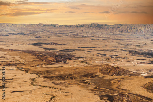 Ramon Crater Makhtesh Ramon, the largest in the world, as seen from the high rocky cliff edge surrounding it from the north, Ramon Nature reserve, Mitzpe Ramon, Negev desert, Israel. High quality