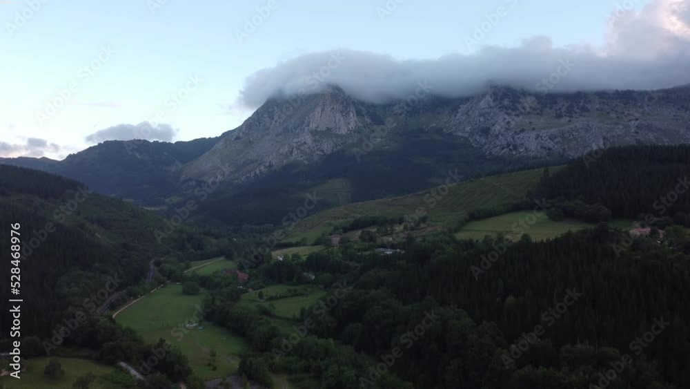 Mountain with clouds on top in the green valleys of the Basque Country, spain Mountain with clouds on top in the green valleys of the Basque Country, spain