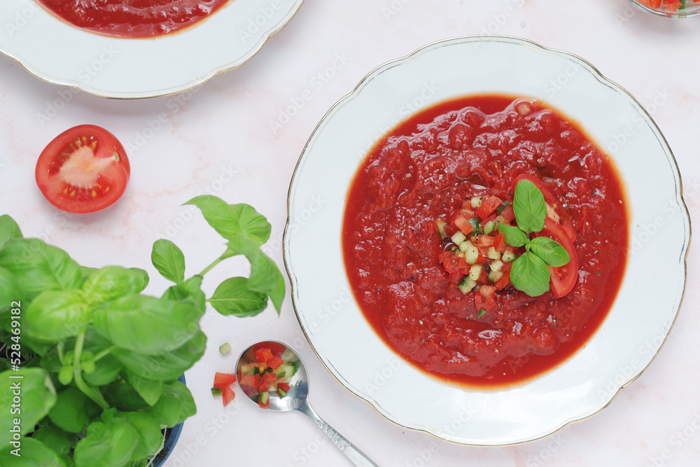 Plates with traditional gazpacho tomato soup Plates with traditional gazpacho tomato soup