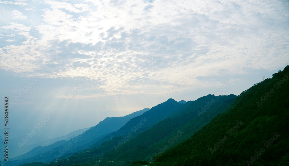Mesmerizing view of sun rays on Ta Xua Mountain range of northern Vietnam