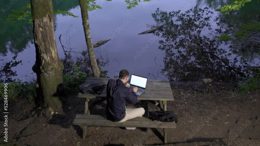 Happy businessman working in the forest.
Businessman sitting on bench in forest happily working with his laptop.
Happy businessman working in the forest.
Businessman sitting on bench in forest happily working with his laptop.