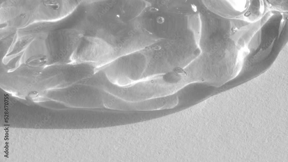Transparent Beauty gel flowing on white background 