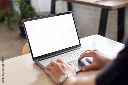 computer screen blank mockup.hand woman work using laptop with white background for advertising contact business search information on desk at coffee shop.marketing and creative design