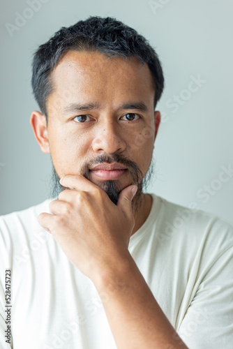 Smart asian moustache man thinking something beauty art fashion