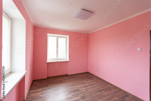 light pink color wall with modern lamp and empty concept and frame.