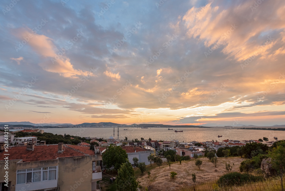 Colorful city by sunset, aliaga gulf with a colorful sunset clouds and lights Colorful city by sunset, aliaga gulf with a colorful sunset clouds and lights