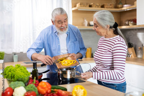Healthy Eating For Seniors. Portrait Of Elderly Spouses Cooking Together In Kitchen