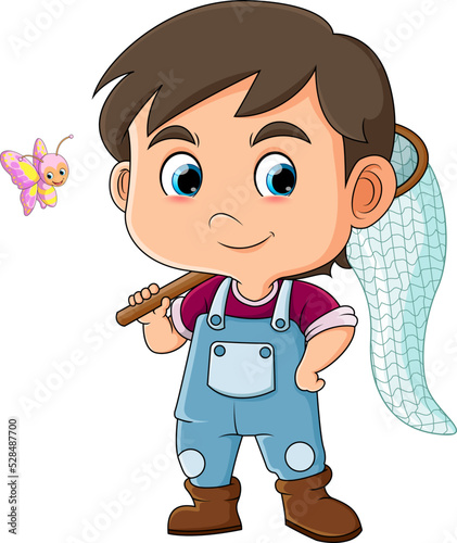 The cool boy is ready to catch a cute small butterfly while holding net