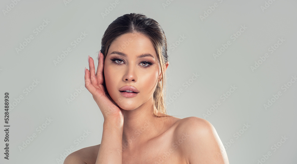 Photo of beauty face of the young attractive woman with a healthy skin and glamour delicate makeup. Closeup portrait of caucasian female. Photo of beauty face of the young attractive woman with a healthy skin and glamour delicate makeup. Closeup portrait of caucasian female.