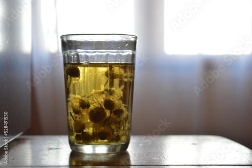 glass of tea with medicinal chamomile