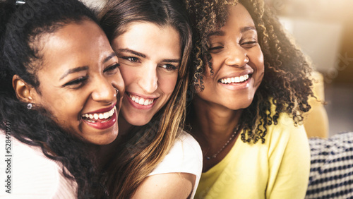Three multicultural young women hugging together - Beautiful females portrait - Friendship concept
