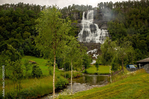 People, visiting Tvinnefossen waterfall, children enjoying the amazing views in Norway to fjords, mountains and other beautiful nature photo