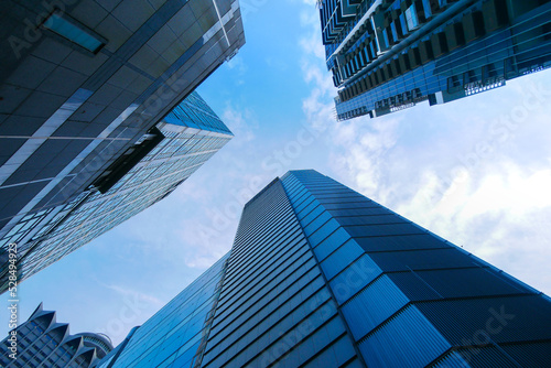 Photography low angle view of singapore city buildings.