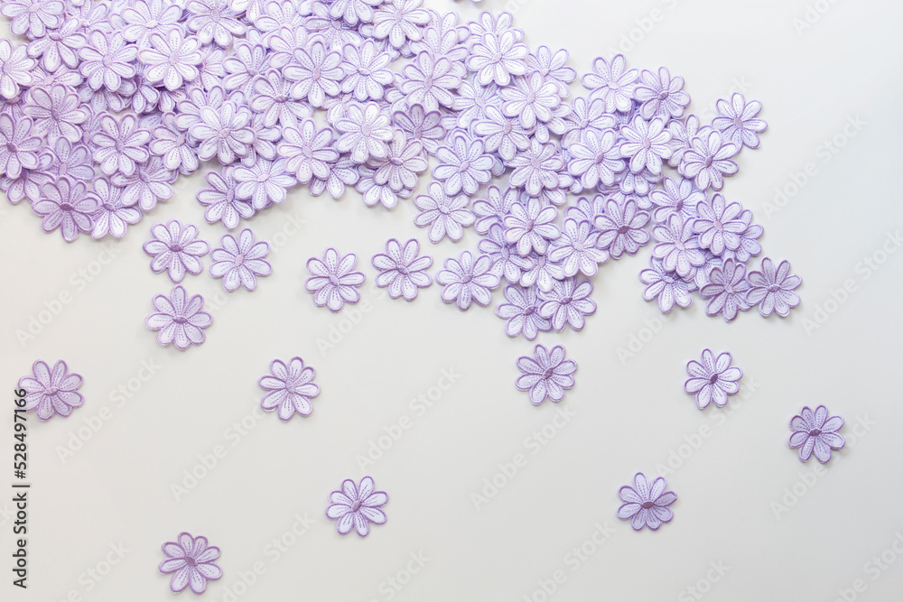 Embroidery colorful flowers pattern texture on a white background for design work texture or decorate wedding invitation greeting card background.