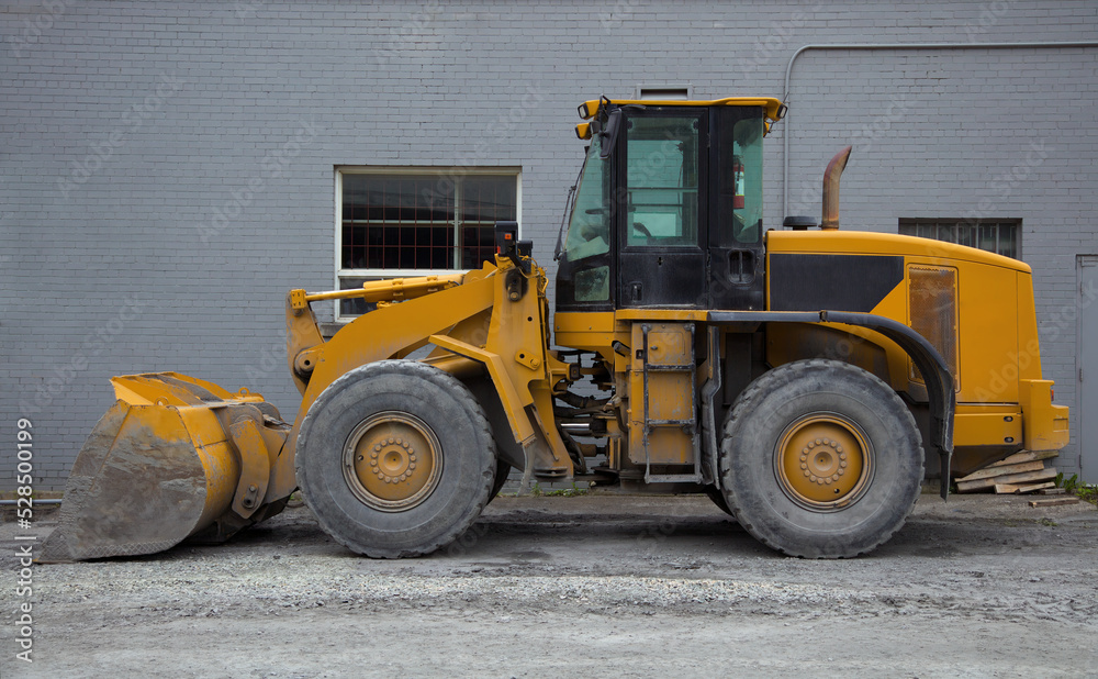 tractor loader on construction site heavy duty yellow hydraulic equipment tractor loader on construction site heavy duty yellow hydraulic equipment