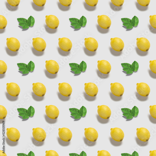Pattern with lemon and mint leaves  on white background . Top view. Pop art design, creative summer food concept.