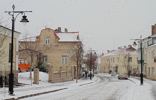 Winter view of Cathedral Street in the Old Town of Lutsk. Fresh snow is falling, Christmas time