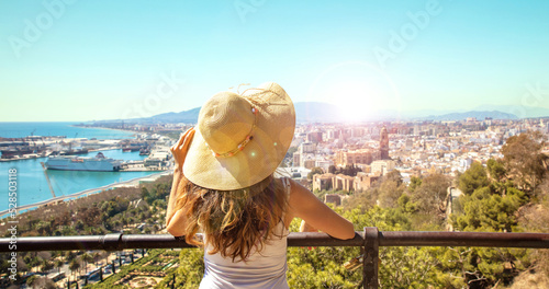 Fotobehang Woman looking at panoramic view of Malaga- Andalusia in Spain