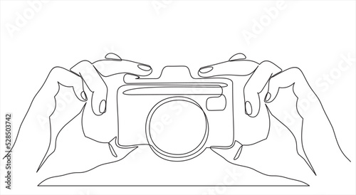 Vector Illustration of Hands Holding a Digital Camera- continuous line drawing