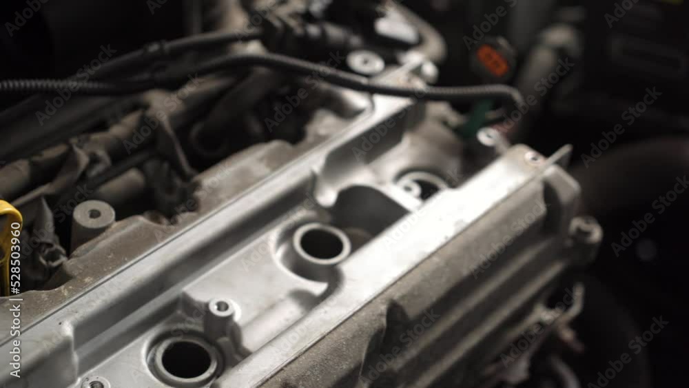 auto mechanic repairs car engine. auto repair shop. spark plug replacement auto mechanic repairs car engine. auto repair shop. spark plug replacement