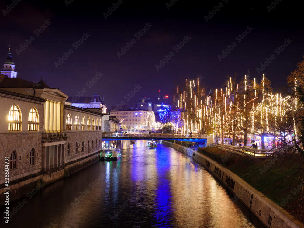 River Ljubljanica at Christmas time with all the lights and decorations, Ljubljana Slovenia