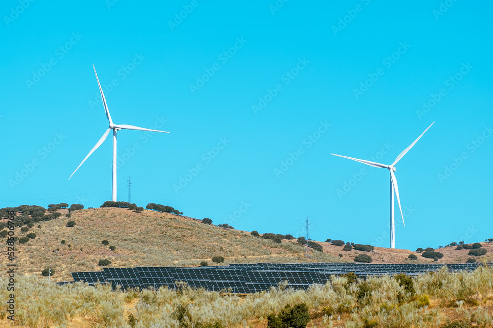 Solar energy panel photovoltaic cell and wind turbine farm power generator in nature landscape. Solar energy panel photovoltaic cell and wind turbine farm power generator in nature landscape.