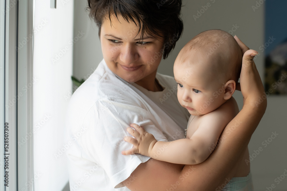 picture of happy mother with baby in hands picture of happy mother with baby in hands