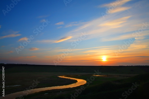 Sunset over the river © Oleksandr