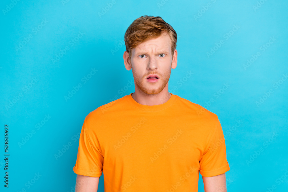 Photo of astonished handsome guy open mouth red hairstyle dressed yellow t-shirt speechless staring isolated on turquoise color background Photo of astonished handsome guy open mouth red hairstyle dressed yellow t-shirt speechless staring isolated on turquoise color background