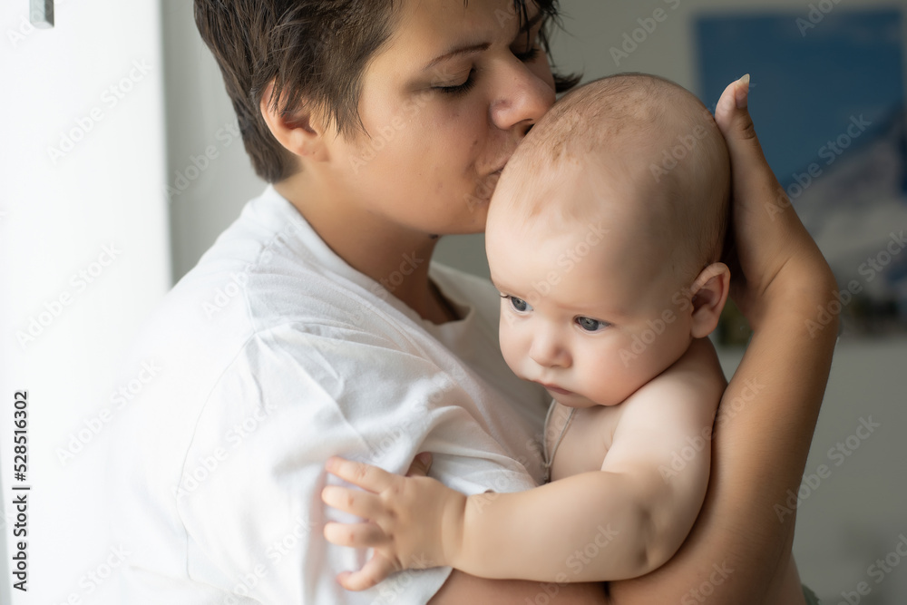 picture of happy mother with baby in hands picture of happy mother with baby in hands